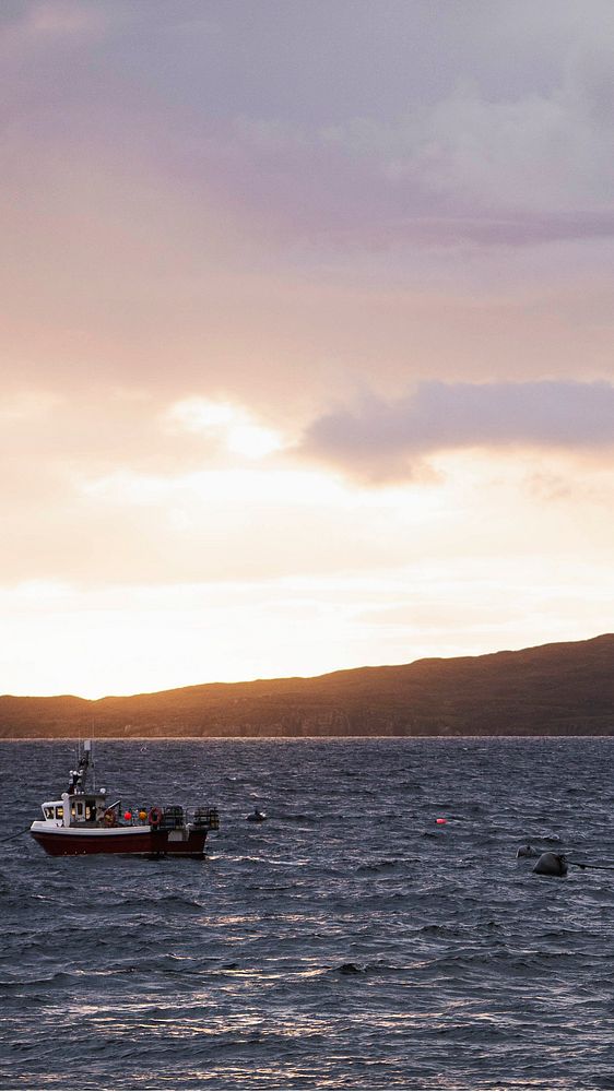 Ocean mobile wallpaper background, fishing boat near Isle of Skye, Scotland