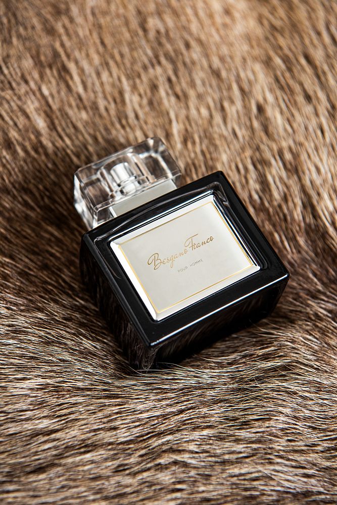 Eau de parfum fragrance bottle on a fluffy blanket