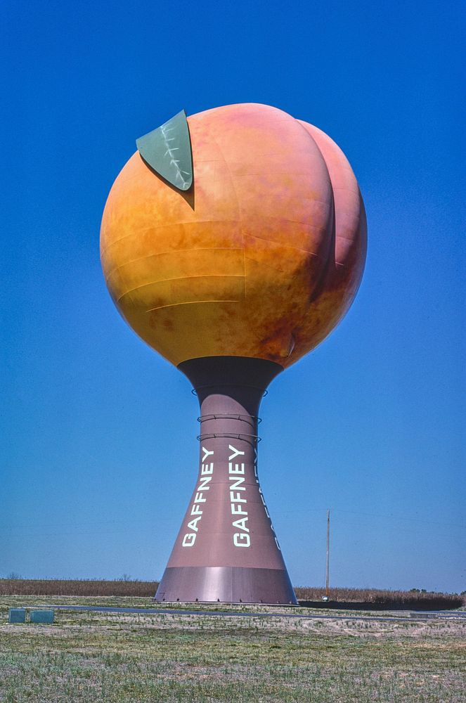 Peach water tower, Gaffney, South Carolina (1988) photography in high resolution by John Margolies. Original from the…