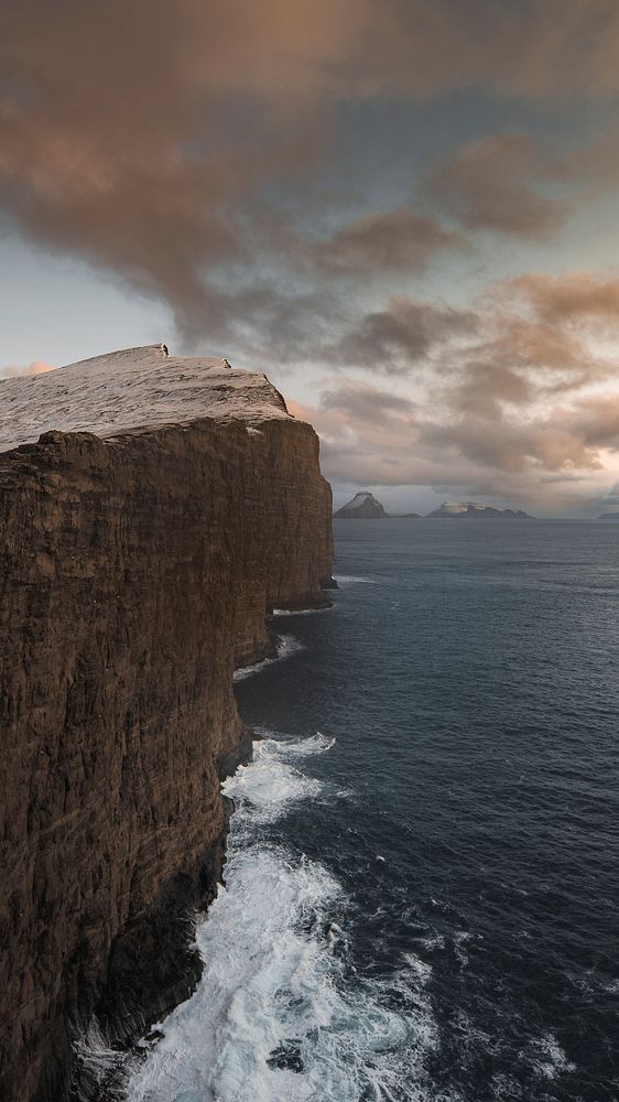 Nature mobile wallpaper background, sunset over the Slave cliff in Faroe islands