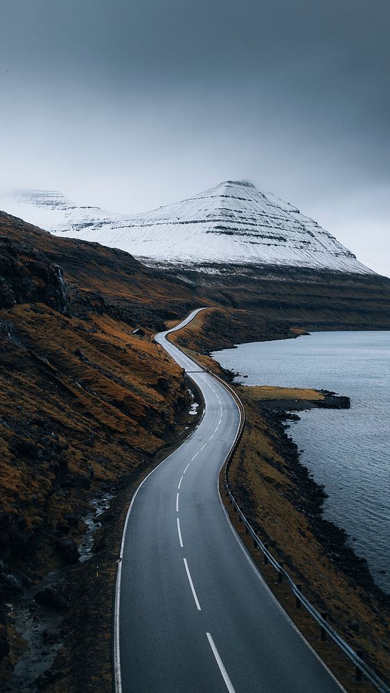 Road iPhone wallpaper background, scenic freeway by the lake on Faroe Islands