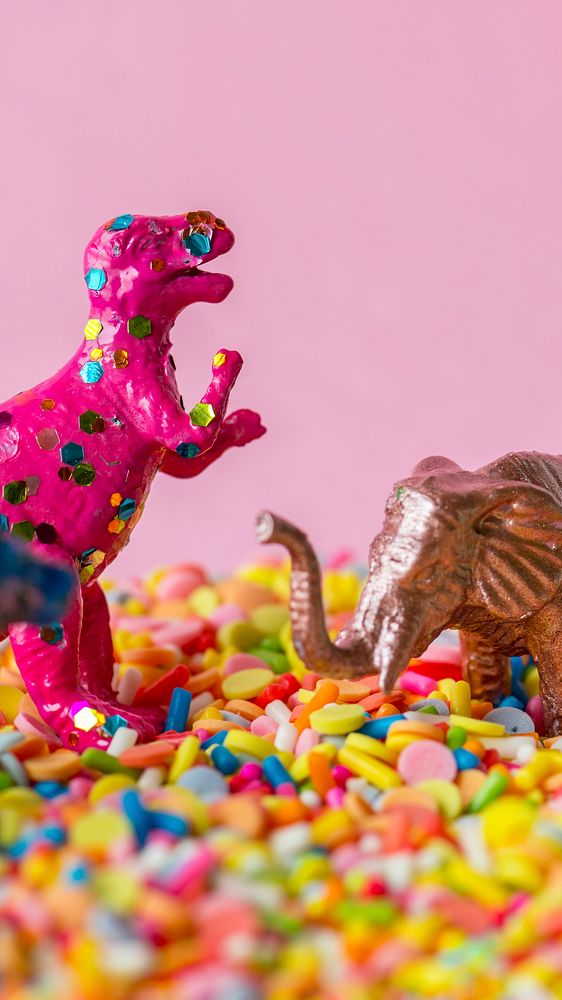 Pink mobile wallpaper, dinosaurs and sprinkles phone background