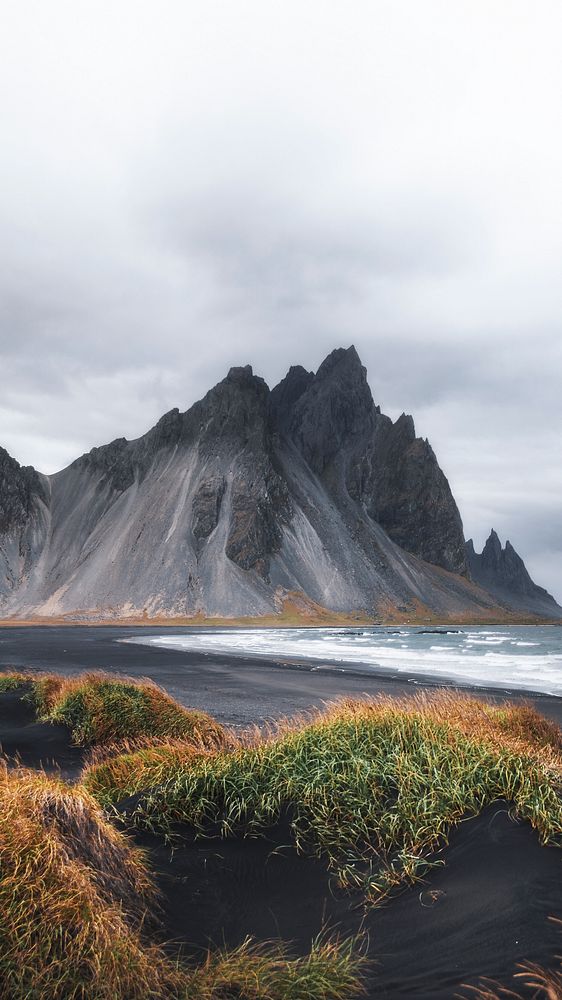 Nature mobile wallpaper background, cloudy black sand beach in Iceland