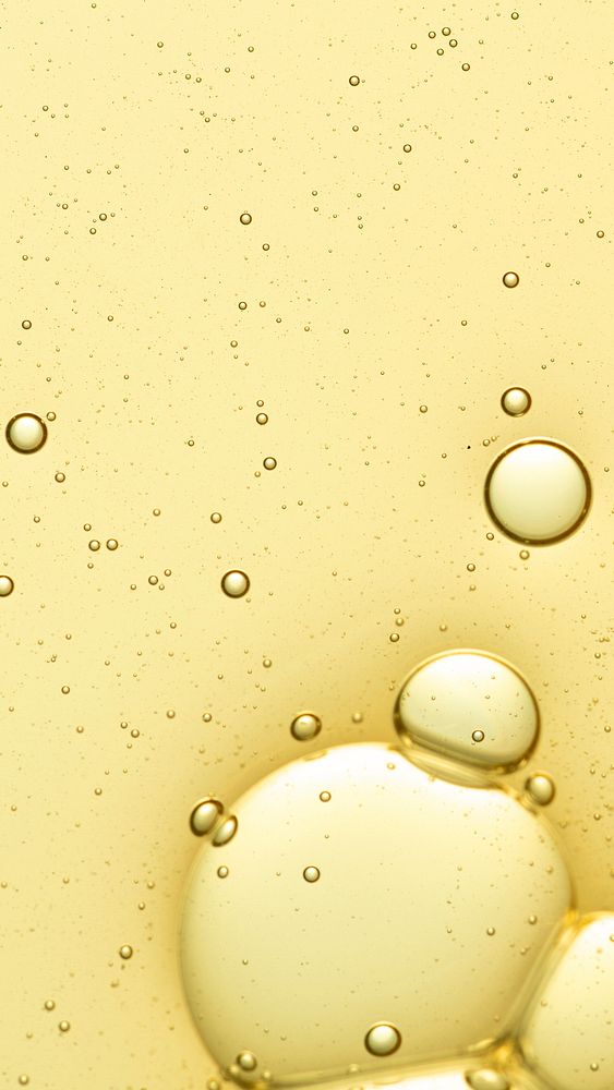 Yellow iPhone wallpaper abstract oil bubble in water background