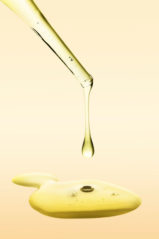 Oil dropper background, gold dripping cosmetic product wallpaper