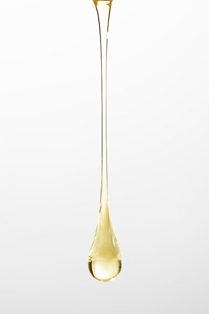 Liquid background gold dripping oil beauty product
