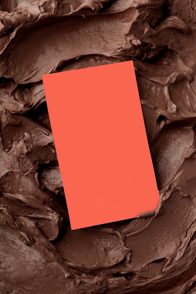 Orange business card on brown frosting texture