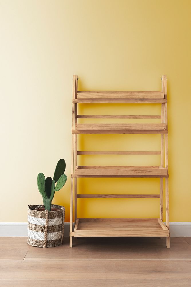 Wooden plant stand with a cactus on the side