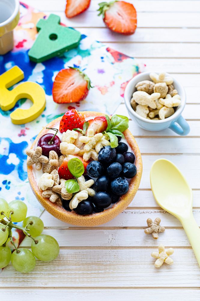 Kids birthday breakfast bowls with cereal and berries