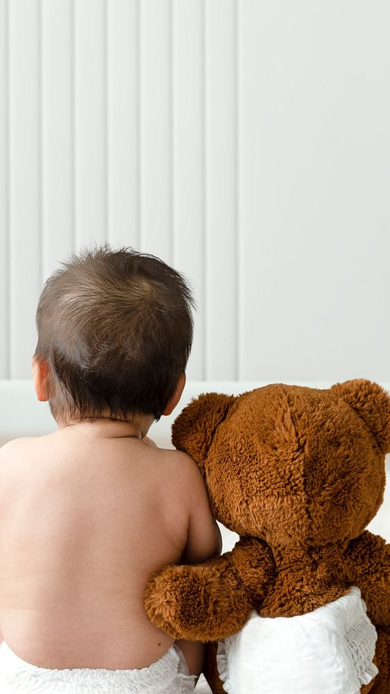 Baby and teddy bear rear view with design space