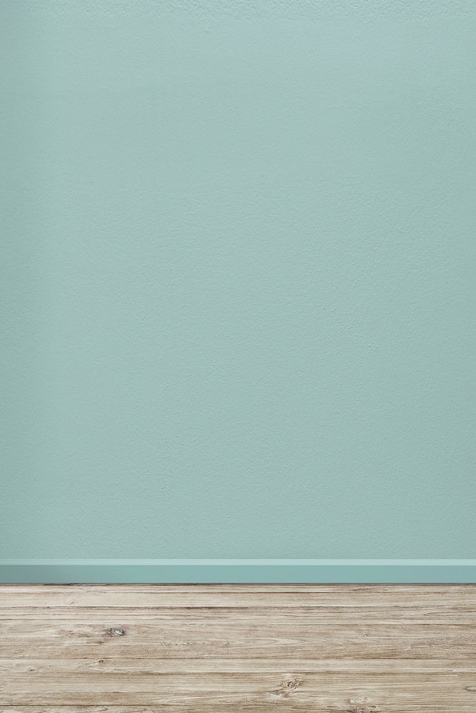 Empty room with pastel turquoise wall