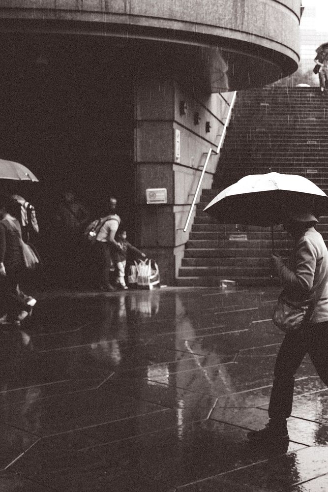 Monochrome rainy day background, people photo