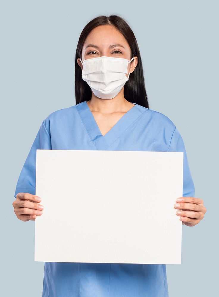 Female doctor showing a blank sign board