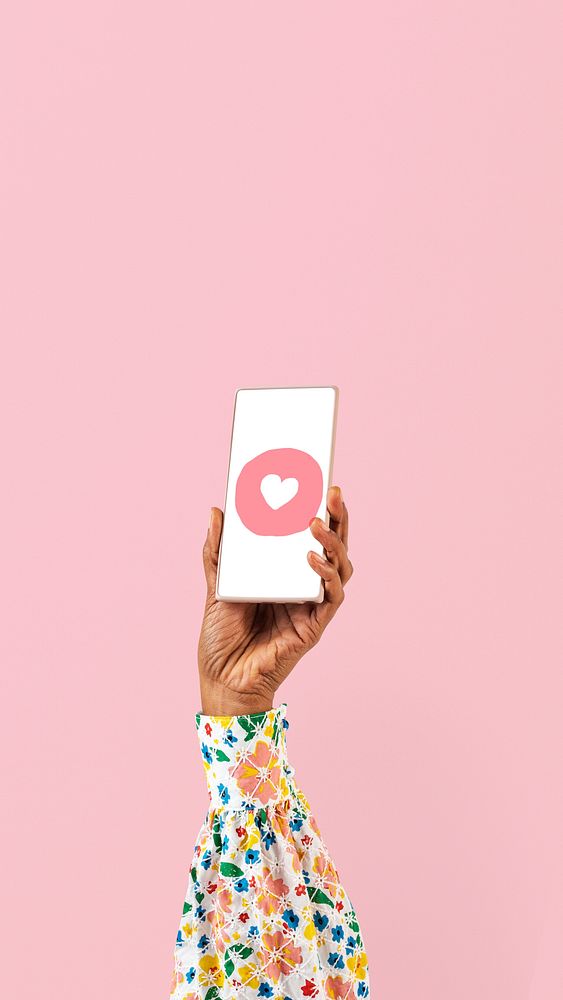 Smartphone screen hand with social media heart icon