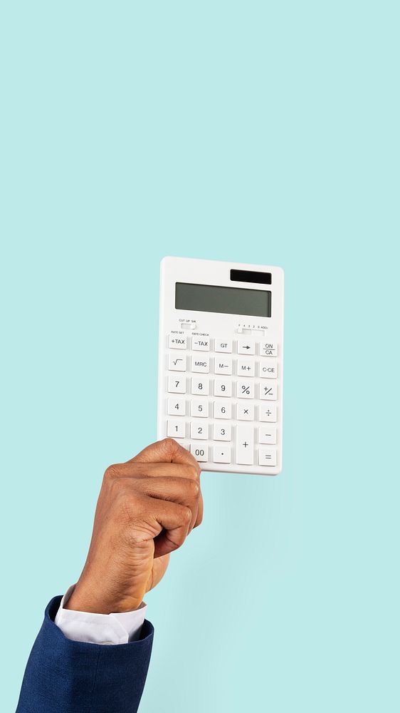 Hand holding calculator in finance concept
