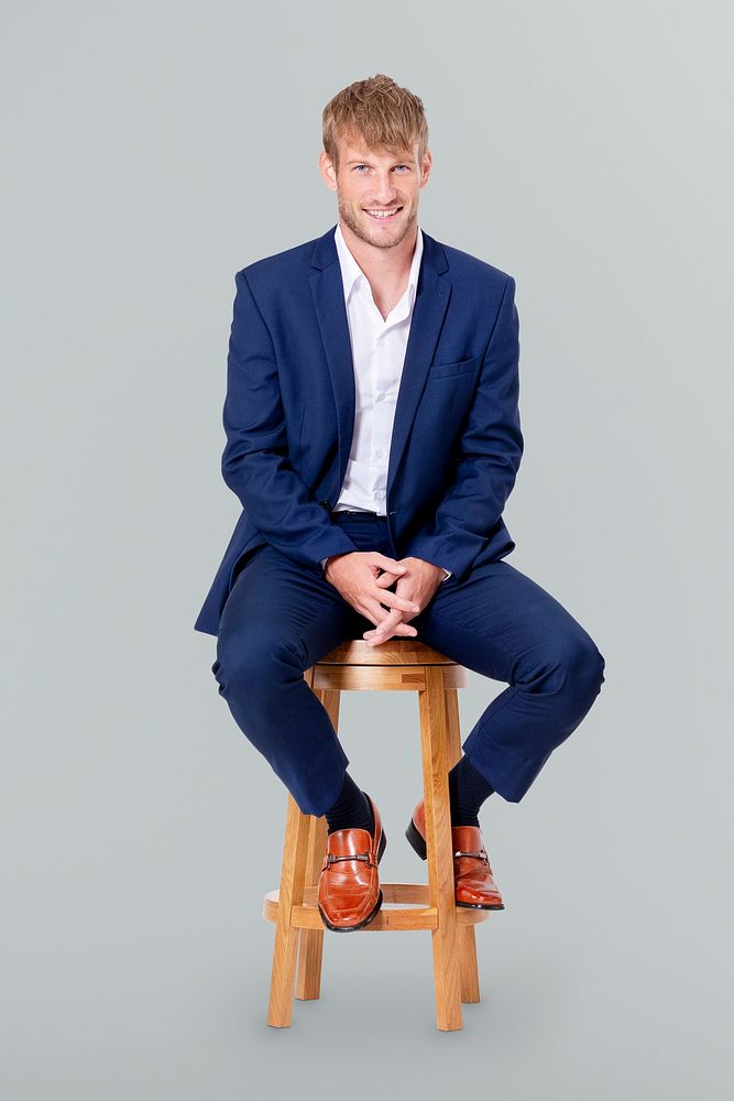 Successful businessman sitting on a wooden stool jobs and career campaign
