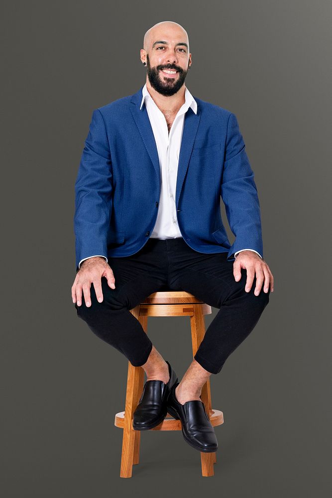 Cheerful businessman sitting on a wooden stool jobs and career campaign
