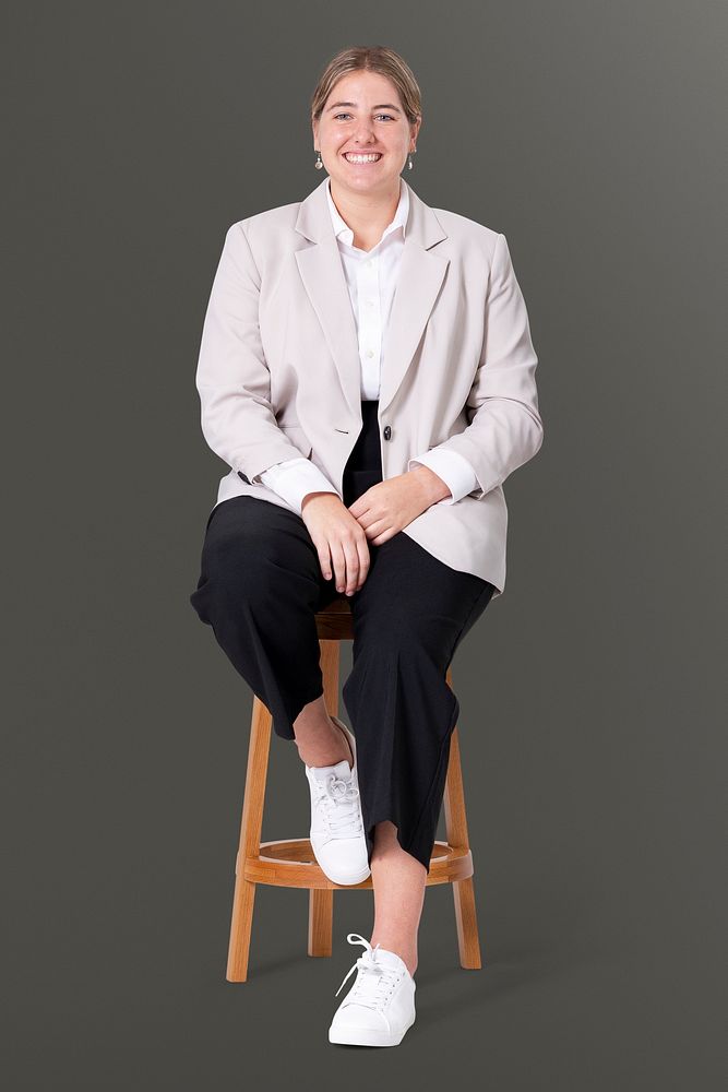 Cheerful businesswoman sitting on a wooden stool jobs and career campaign