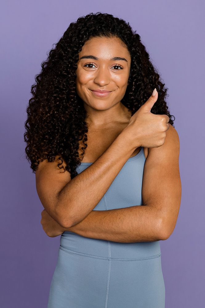 Positive woman giving thumbs up