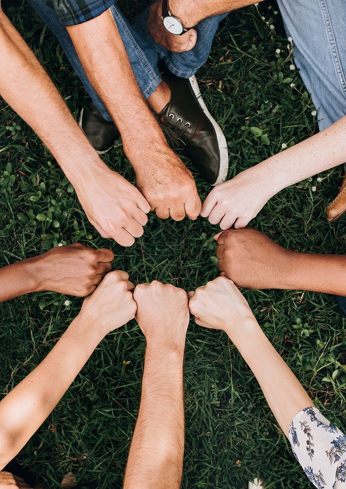 Diverse community with hands in a circle