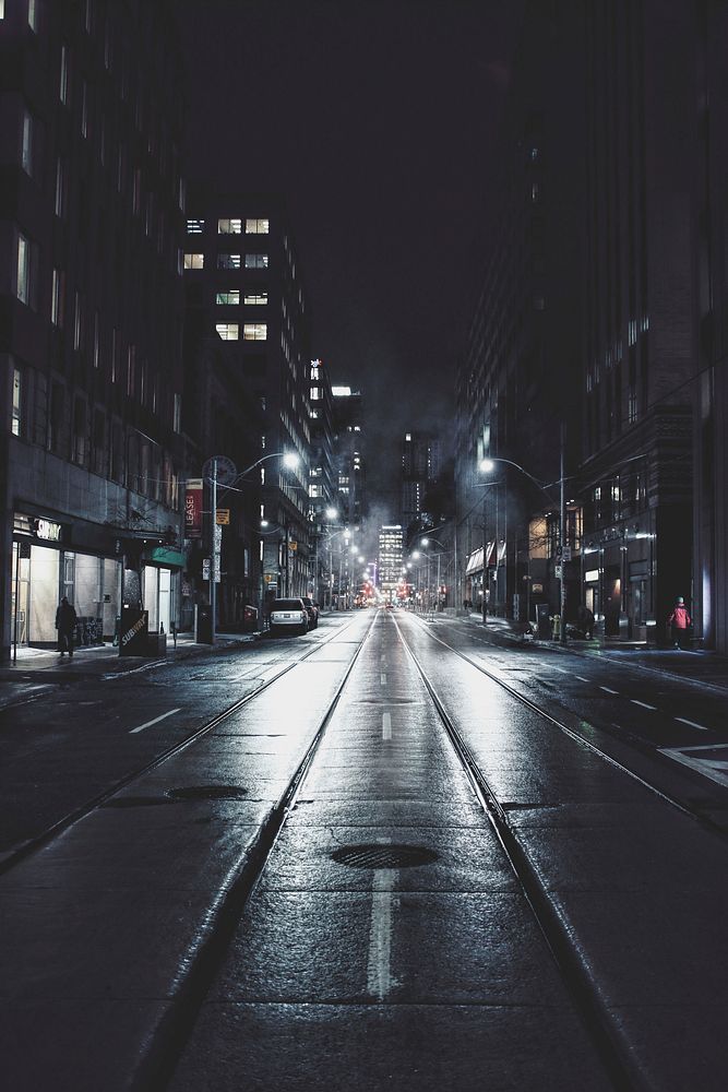 Street views on a dark rainy night in downtown Toronto. Original public domain image from Wikimedia Commons