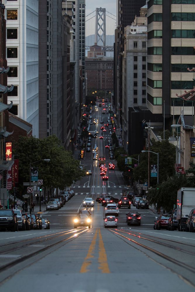 A sloping street in San Francisco in the evening. Original public domain image from Wikimedia Commons