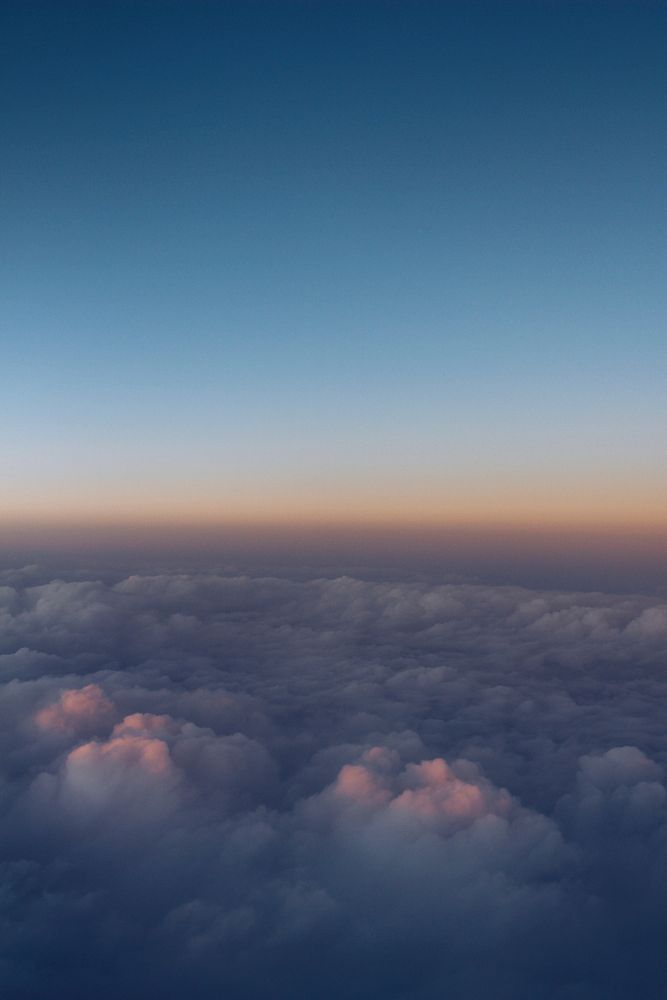 A sea of clouds seen from above during sunset. Original public domain image from Wikimedia Commons