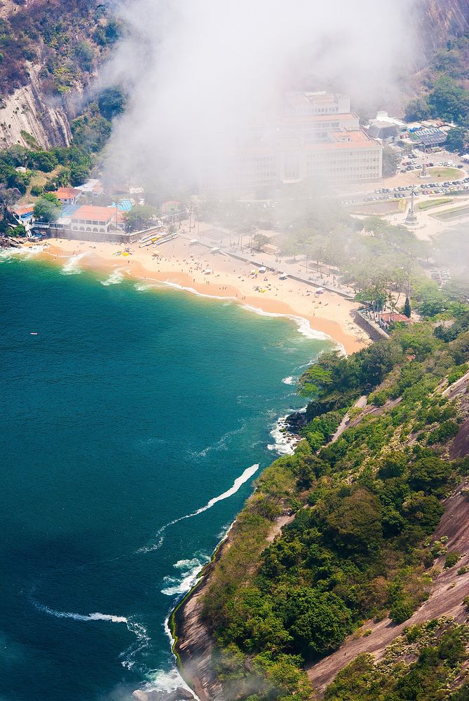 Arial view from above, we can see a big smoke on the beach. Rio de Janeiro, Brazil. Original public domain image from…