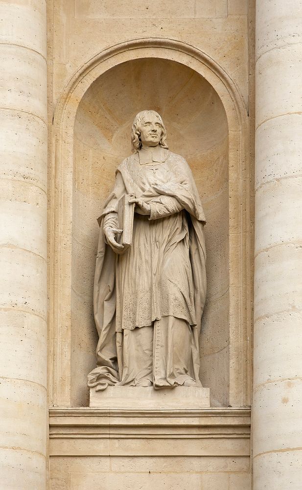 Statue of Jacques-Bénigne Bossuet by Louis-Ernest Barrias (1841-1905). Façade of the chapel of the Sorbonne, Paris, France.…