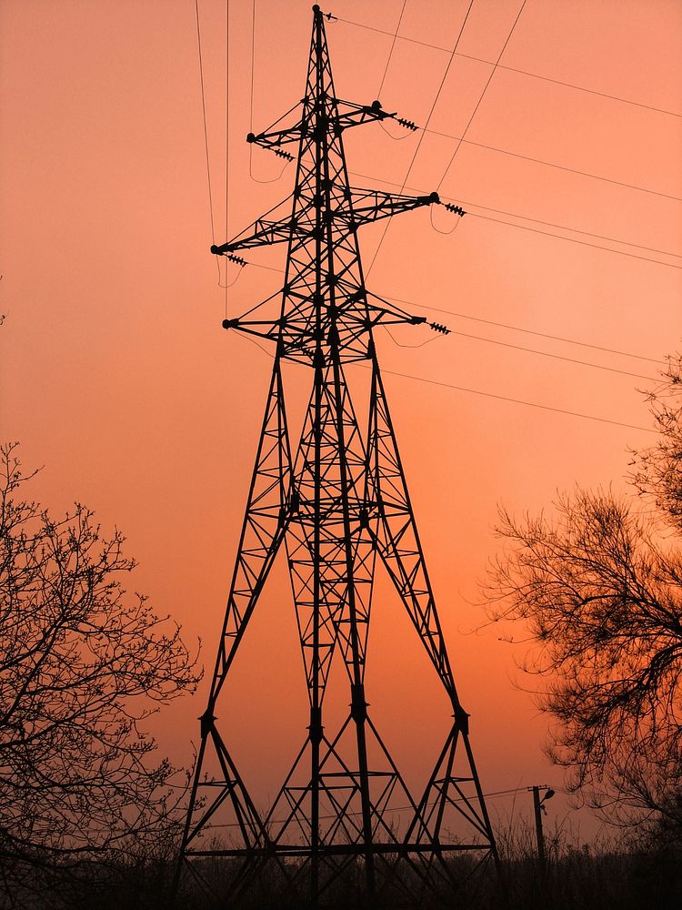 Transmission tower of overhead power lines. Original public domain image from Wikimedia Commons