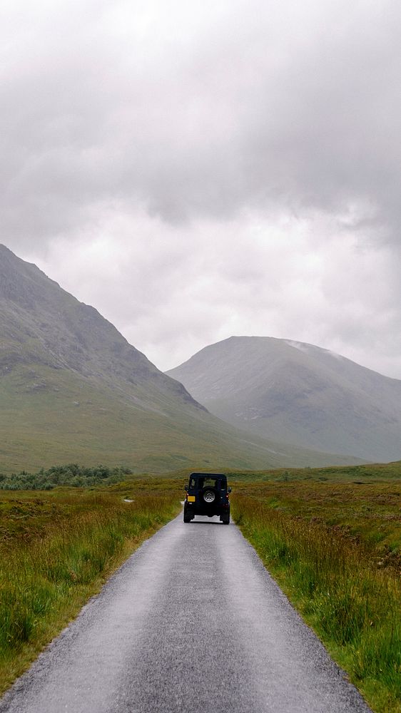 Adventure phone wallpaper background, SUV on a road through the Scottish Highlands, Scotland
