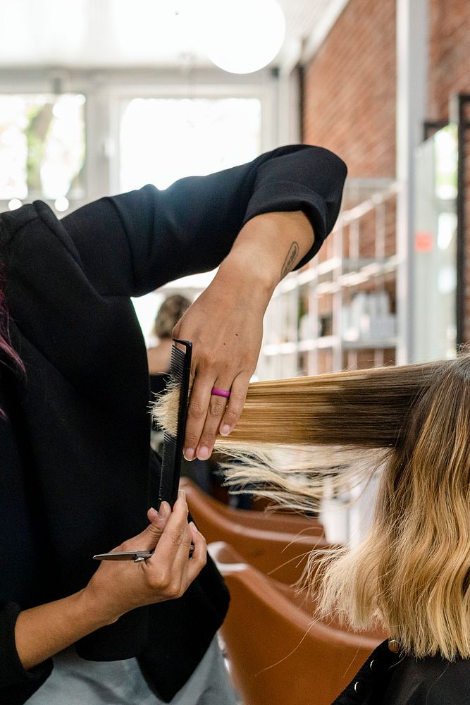 Customer getting a haircut in a beauty salon