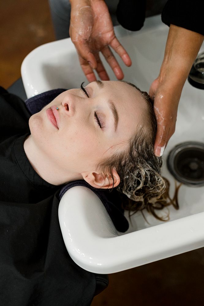 Woman getting a hair wash at a beauty salon 