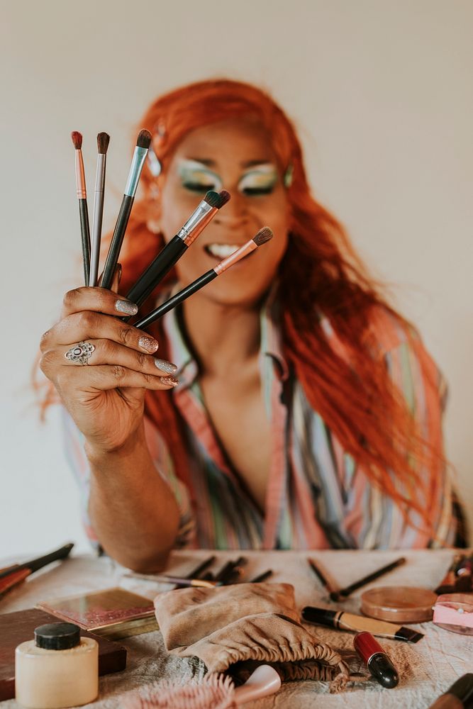 Drag show artist holding makeup tools