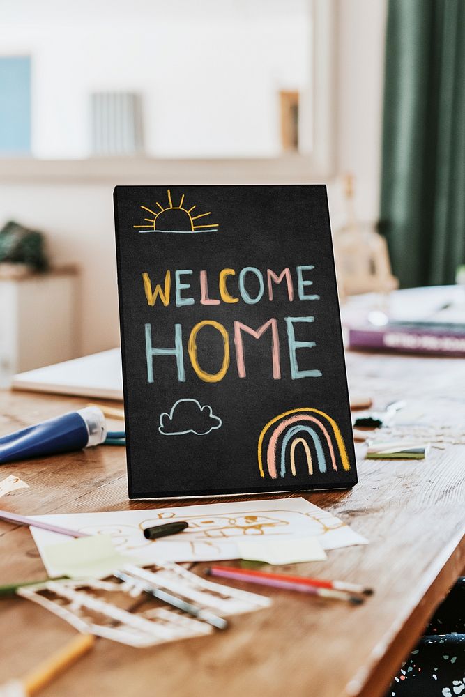 Welcome home sign on wooden table