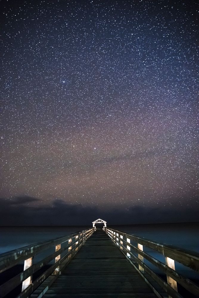 Starry night at Waimea State Recreation Pier in Hawaii, USA