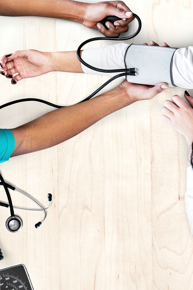 Nurse measuring patient blood pressure background 