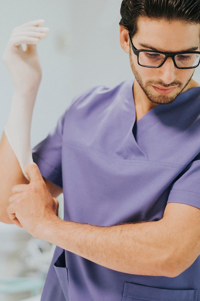 Male nurse putting on a glove background