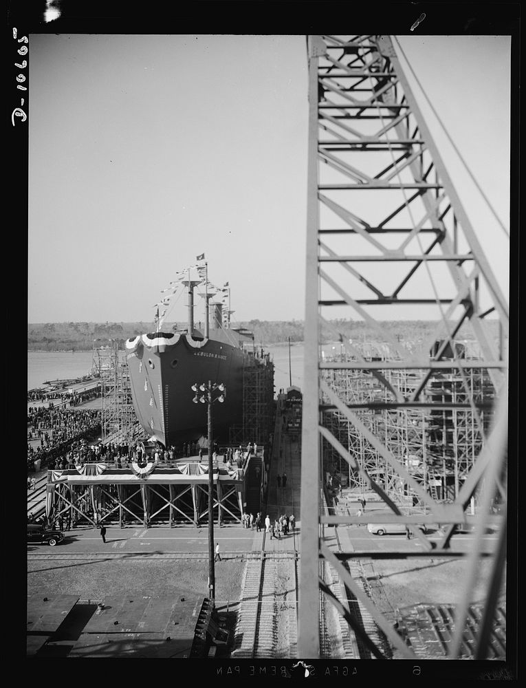Launching of 10,000 ton ships. The first of 90 sister ships to be built for the Maritime Commission slides off the dock into…