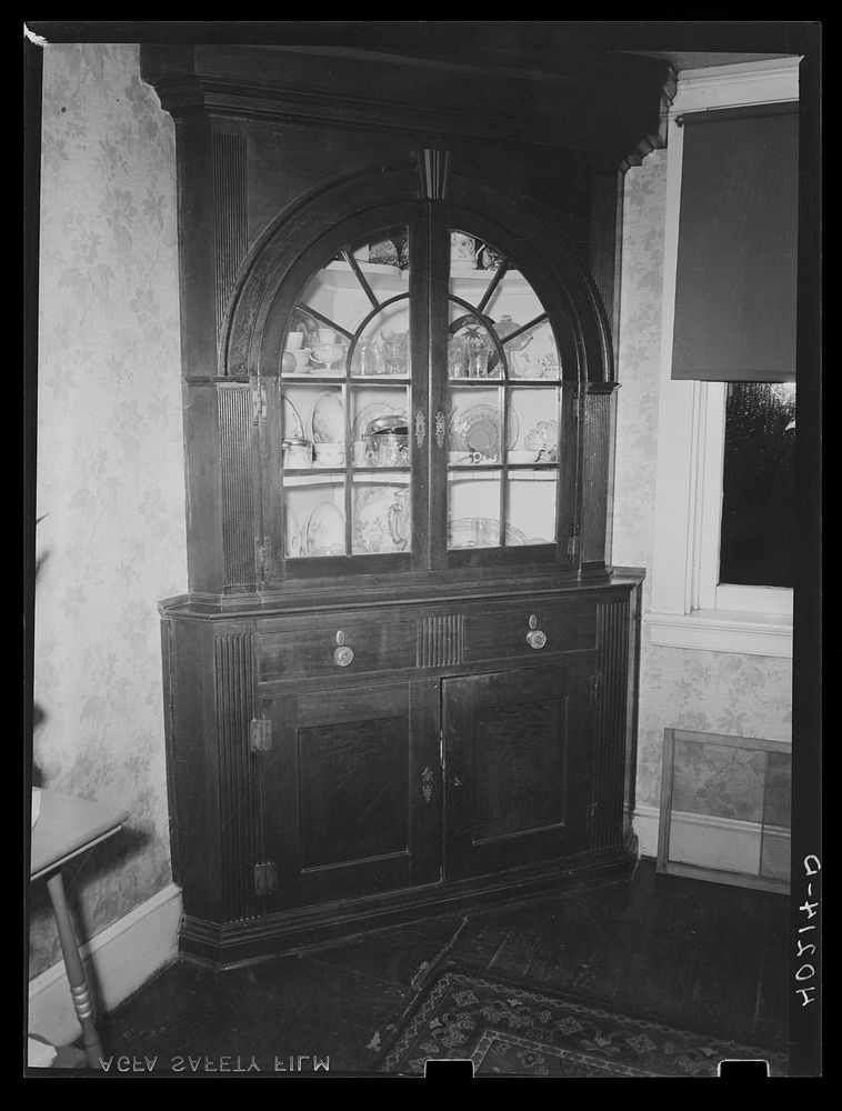 Lancaster County, Pennsylvania. The china cabinet in the dining room of the house on the Enos Royer farm. Sourced from the…