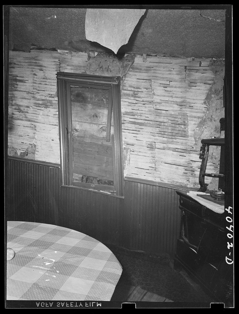 Gilberton, Pennsylvania. Interior of Marcella Urban's house, showing walls from which the plaster has fallen. Sourced from…