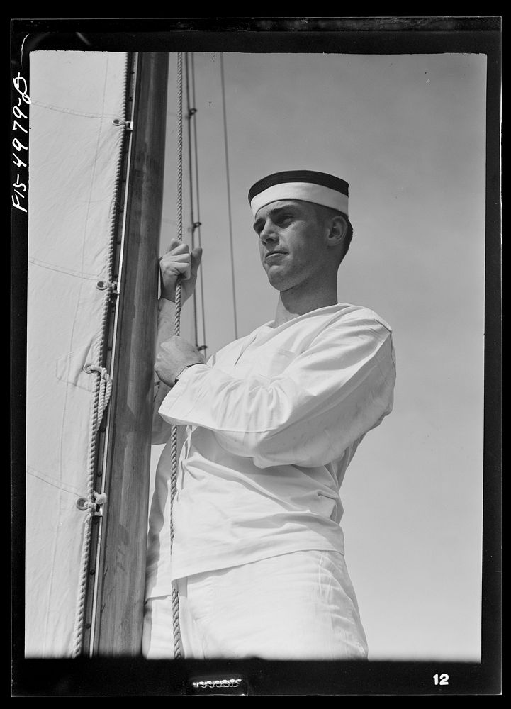 [Untitled photo, possibly related to: U.S. Naval Academy, Annapolis, Maryland. Midshipman hoisting a sail]. Sourced from the…