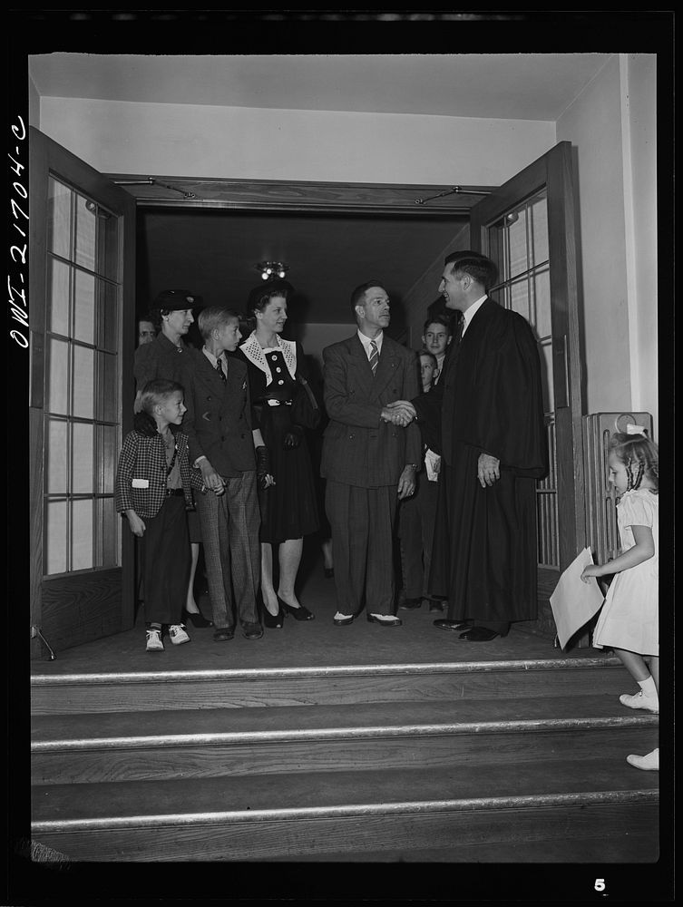 Rochester, New York. The minister greeting the Babcocks as they are leaving church after Sunday services. Sourced from the…