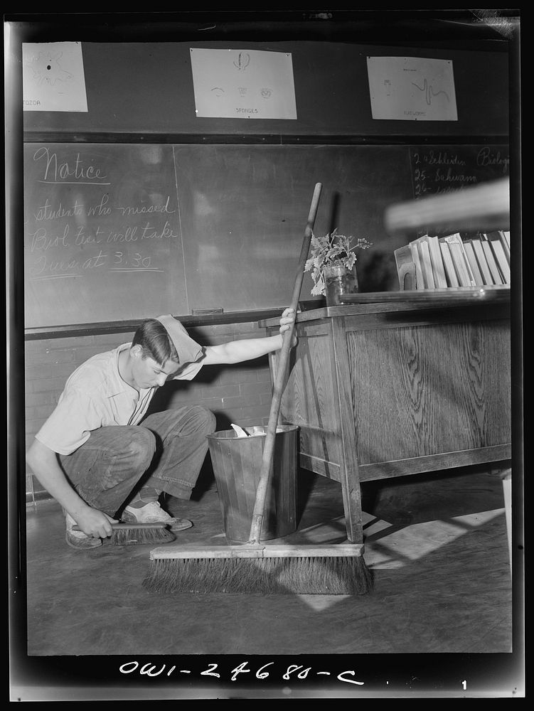 High school boy working as a janitor after school hours. Sourced from the Library of Congress.