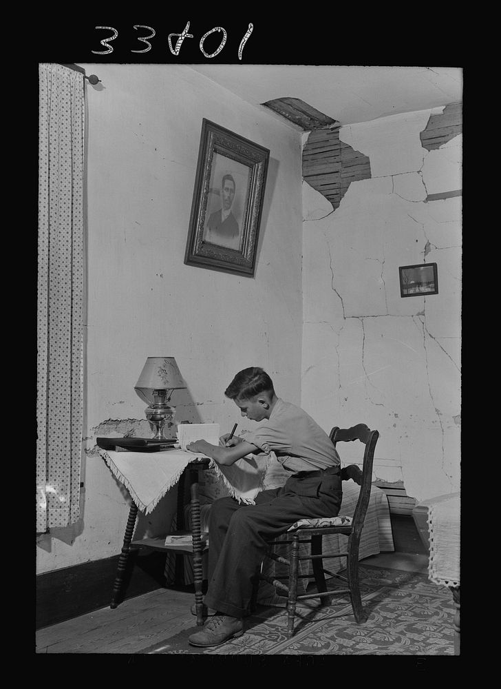 [Untitled photo, possibly related to: Keysville, Virginia. Randolph Henry High School. One of the students studying at…