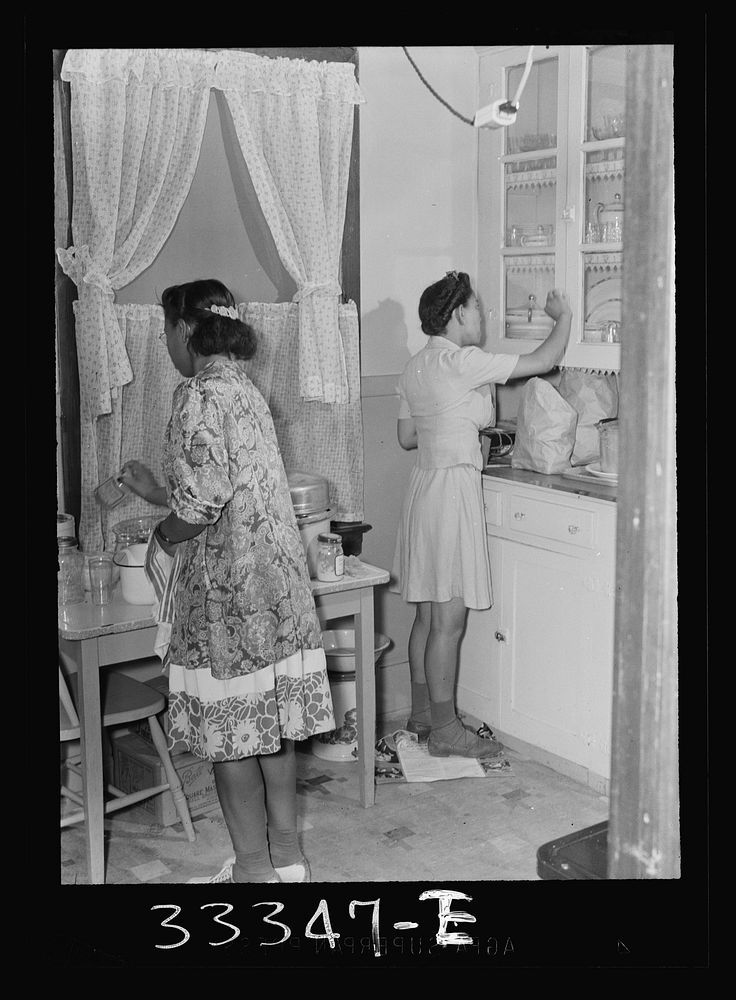 Charlotte Corut House, Virginia. Central High School. Girls in the kitchen of home economics cottage. Sourced from the…