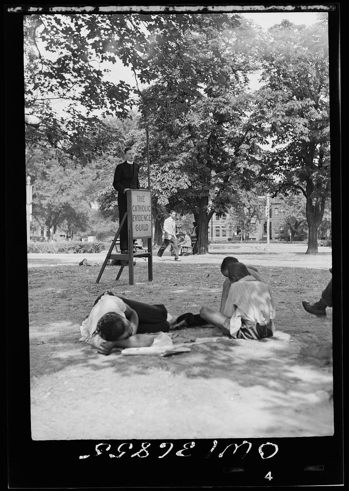 Washington, D. C. A speaker for the Catholic Evidence Guild speaking in Logan Circle on a hot Sunday afternoon. Sourced from…