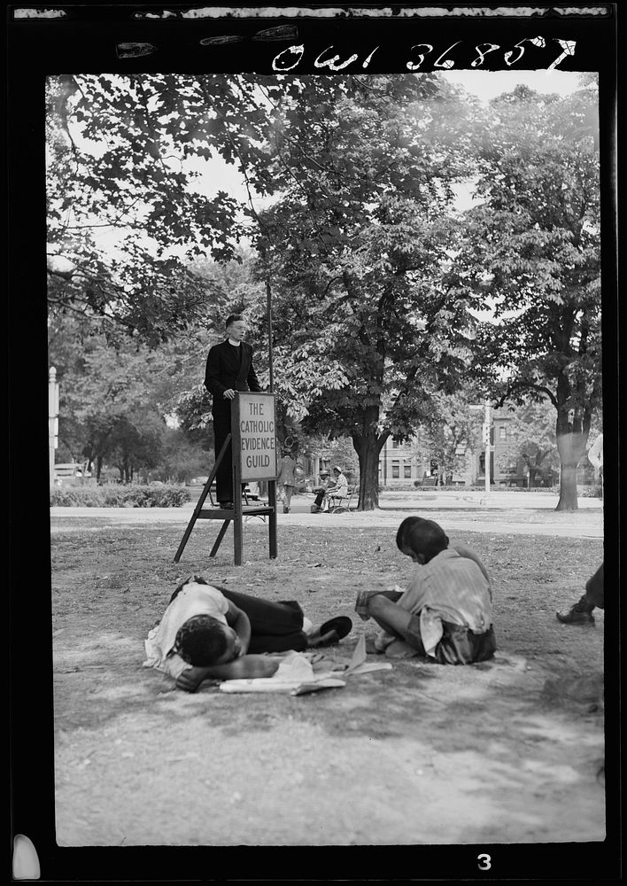 Washington, D. C. A speaker for the Catholic Evidence Guild speaking in Logan Circle on a hot Sunday afternoon. Sourced from…