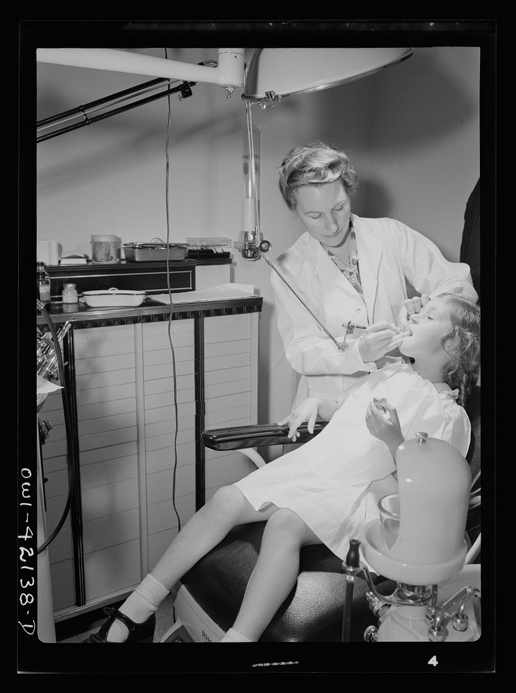 Southington, Connecticut. A little girl is having her teeth fixed in the Center's modern dental clinic. Sourced from the…