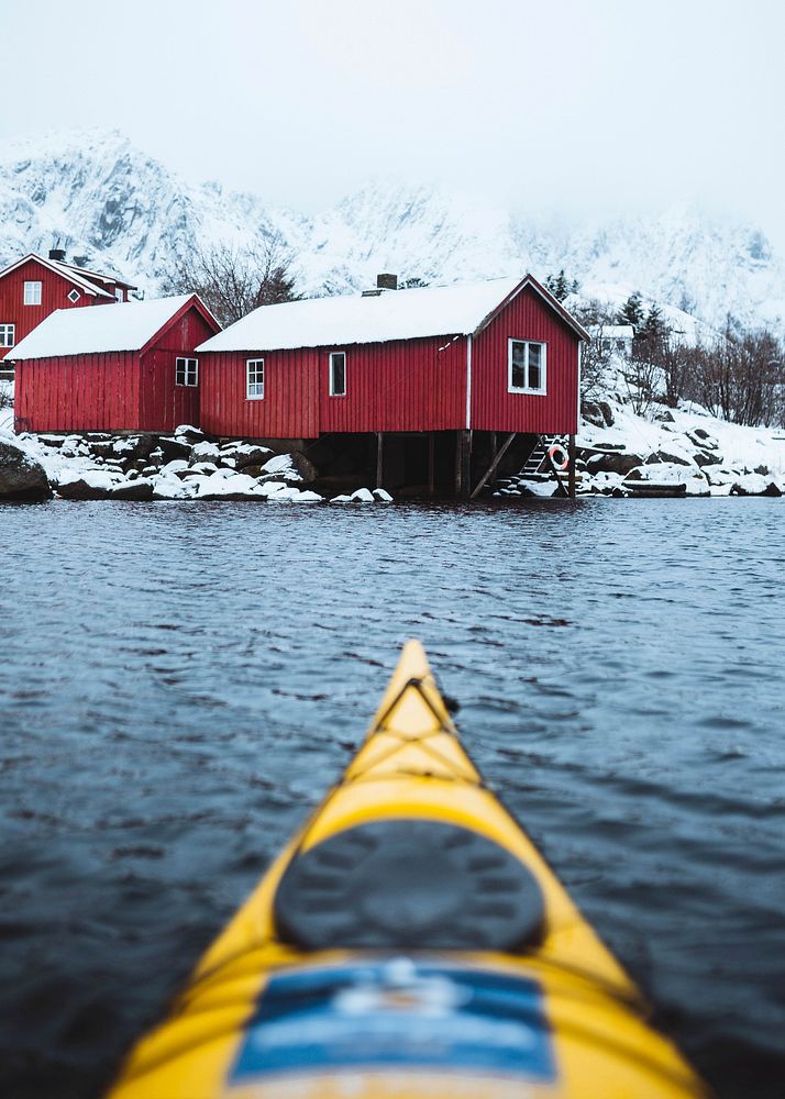 Woman paddling the kayak in Lofoten, Norway